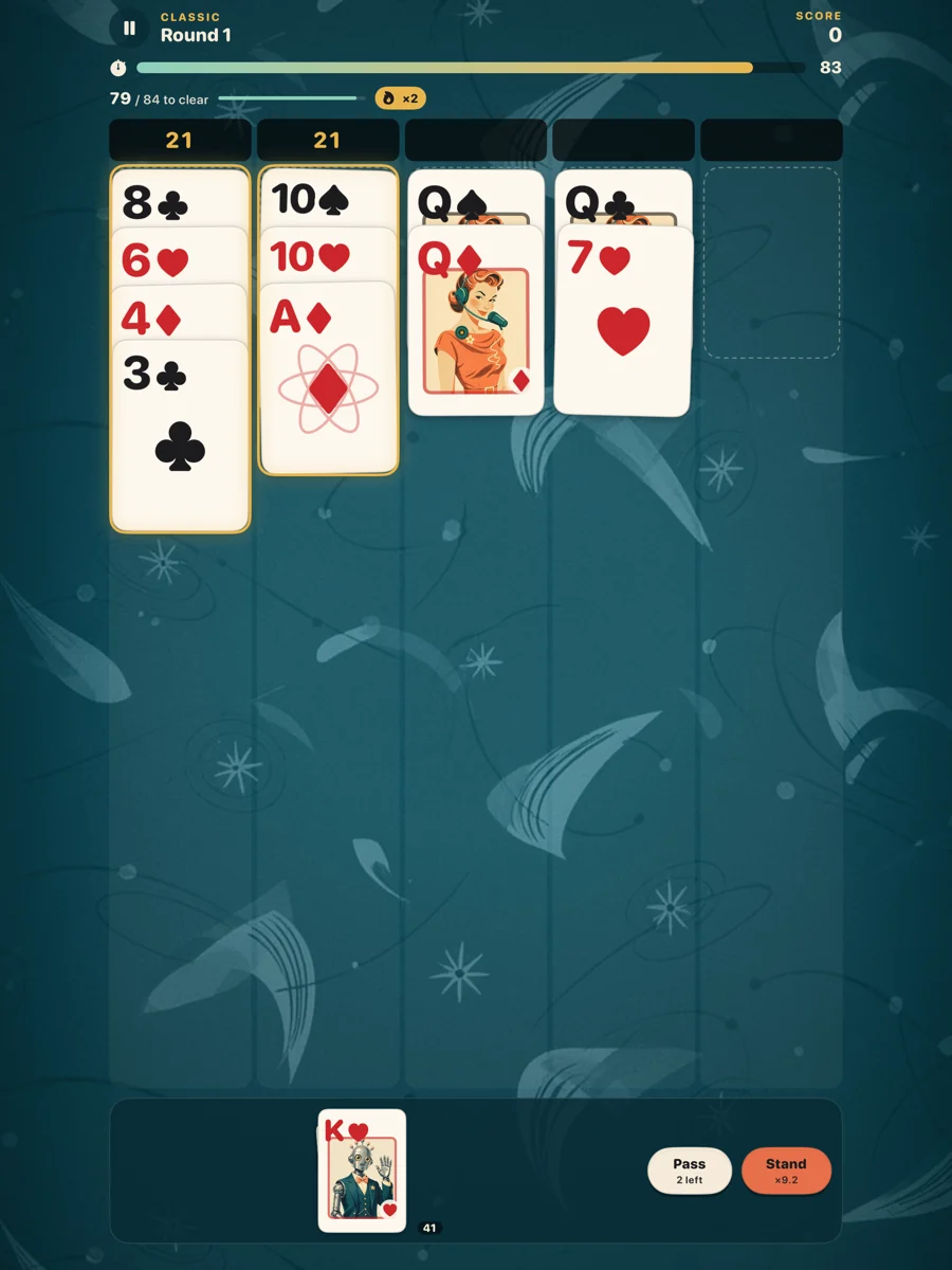 A StackJack round on iPad: two gold stacks of 21, three stacks in progress and the next card waiting.